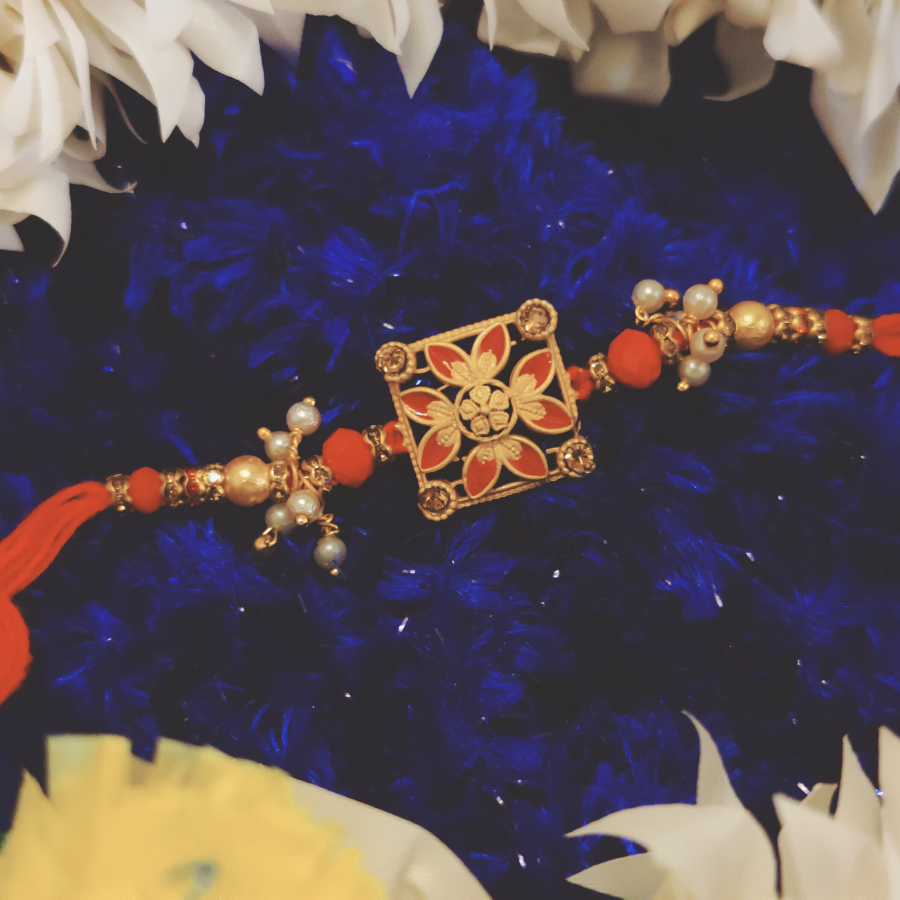 House of Festivals Designer Rakhi - With Flower Motif & White Moti Beads