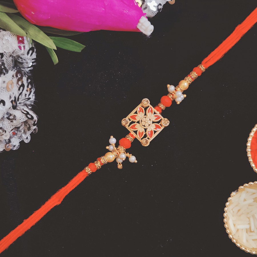 House of Festivals Designer Rakhi - With Flower Motif & White Moti Beads