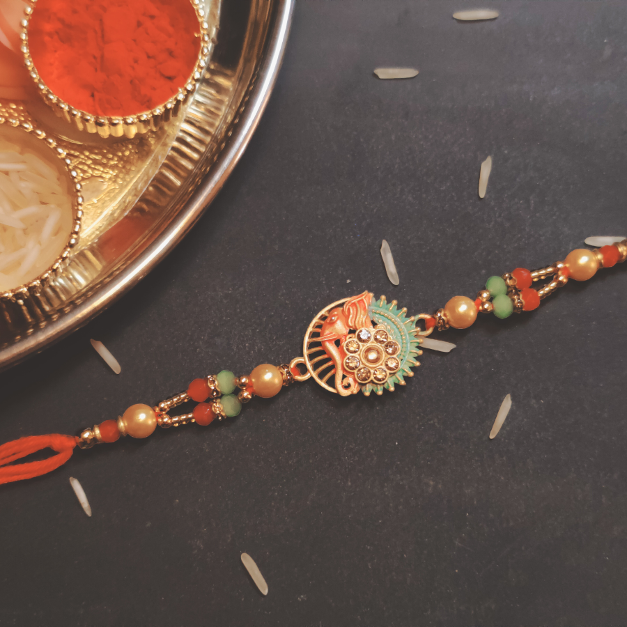 House of Festivals Designer Rakhi - With Lord Ganesh & Sun Pendant