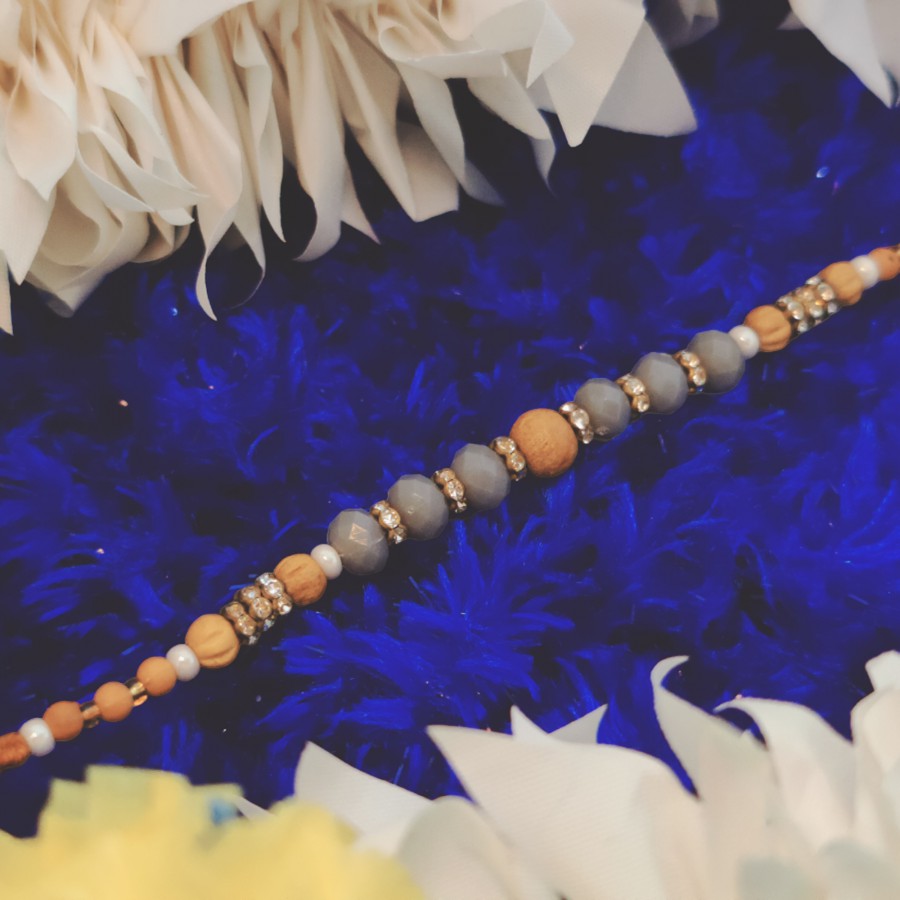 House of Festivals Dori Rakhi - With Blue & Brown Pearl Beads