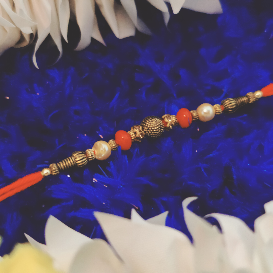 House of Festivals Dori Rakhi - With Golden Moti Beads