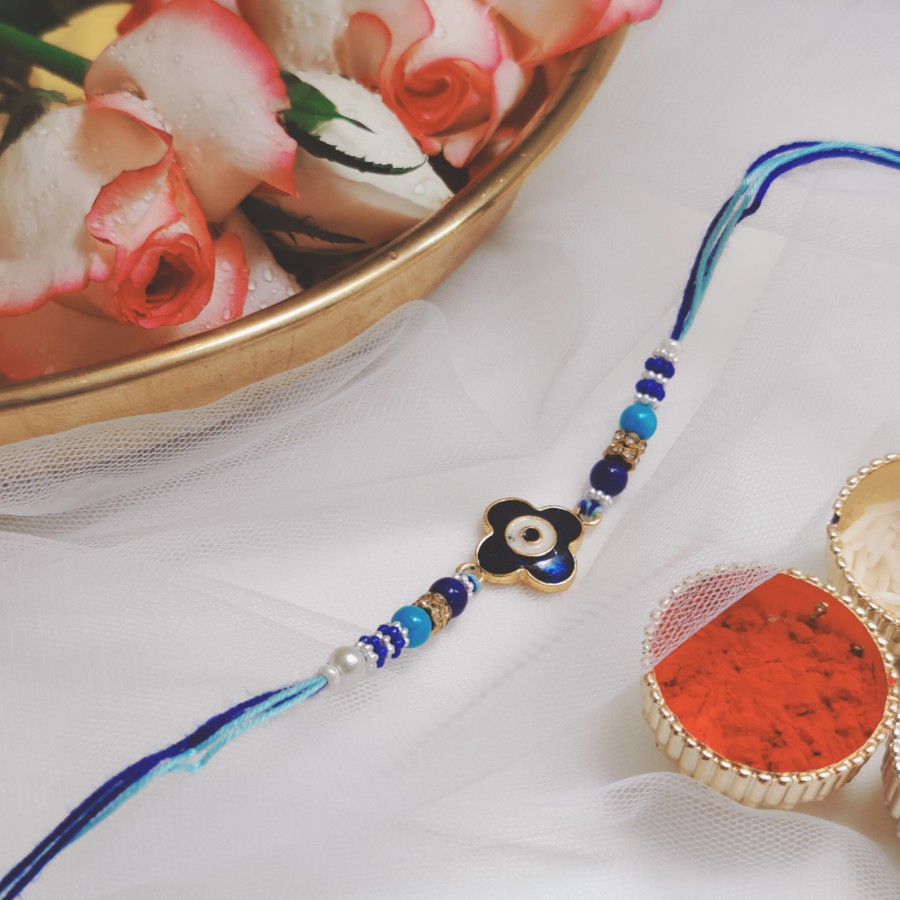 House of Festivals Evil Eye Flower Charm Rakhi - With Pearl Beads