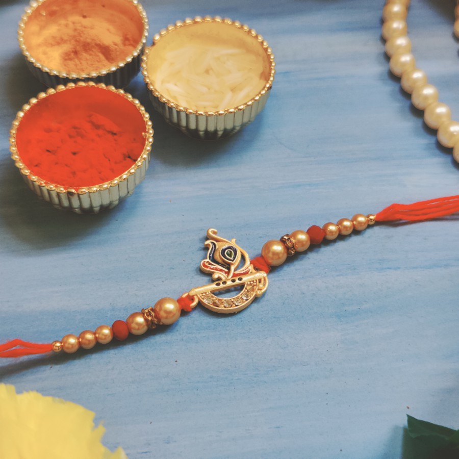 House of Festivals Krishna's Bansuri Rakhi - With Sparkling Stones