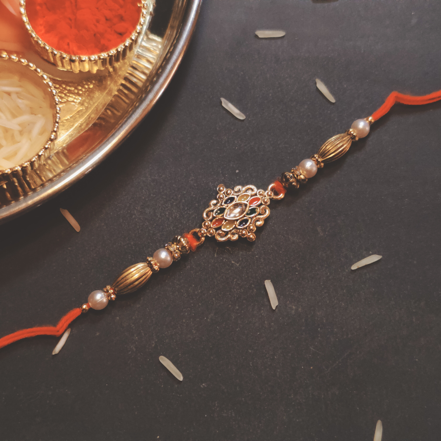 House of Festivals Kundan Work Eleptical Shape Pendant Rakhi - HOF-RK23-7558