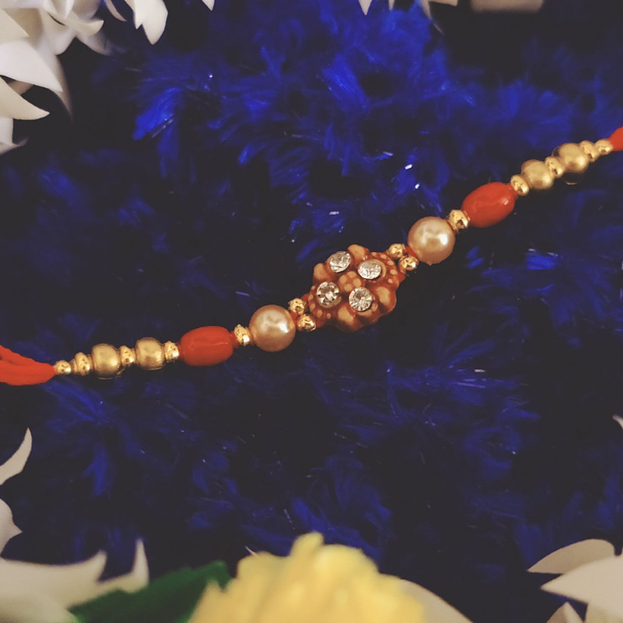 House of Festivals Mauli Rakhi - With Red Flower Design