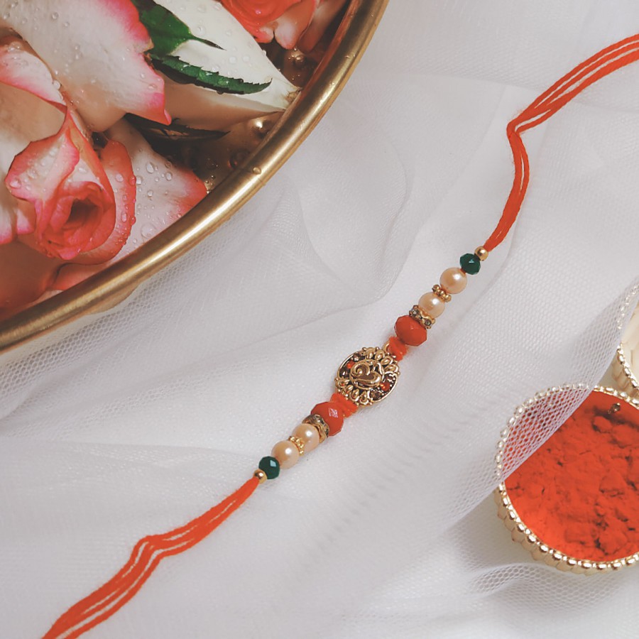 House of Festivals Om Pendant Rakhi - With Pearl Beads