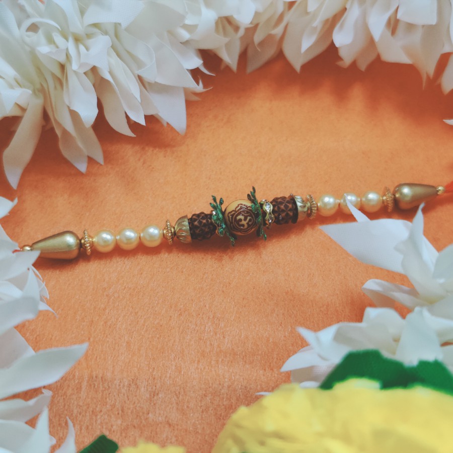 House of Festivals Om Rakhi - With Leaves & Pearl Beads