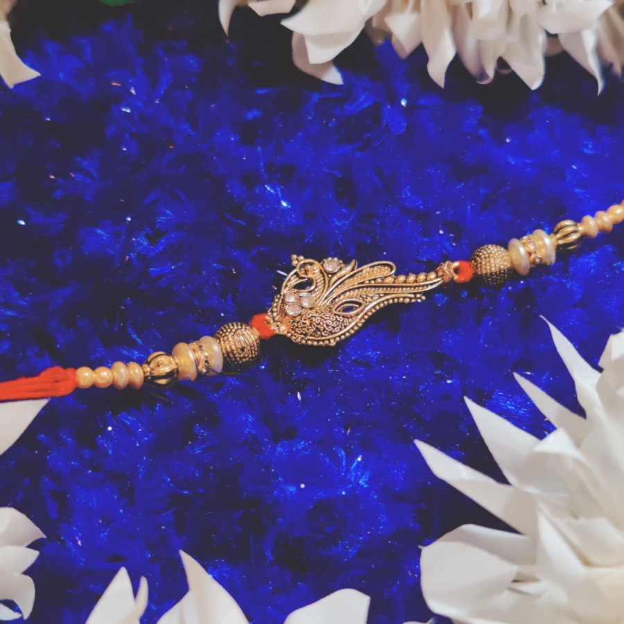 House of Festivals Peacock Golden Pendant Rakhi - With Beads