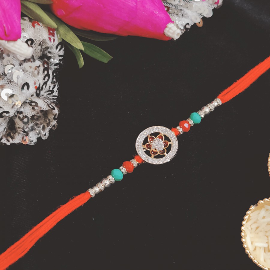 House of Festivals Premium American Diamond Rakhi - With Pearl Beads