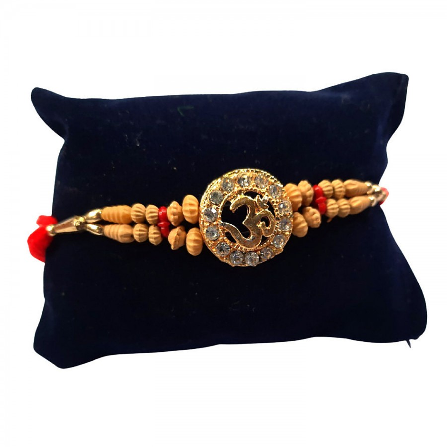 Unique Arts & Interiors Rakhi - Embellished Om In Stone Studded Flower