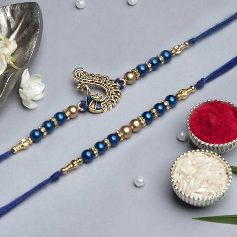 eCraftIndia Blue & Golden Pearls & Peacock Designer Rakhis